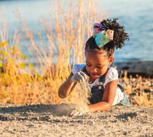 girl, sand, playing, black, african american, kid, child, young, beach, seashore, shore, summer, nature, vacation, holiday, happy